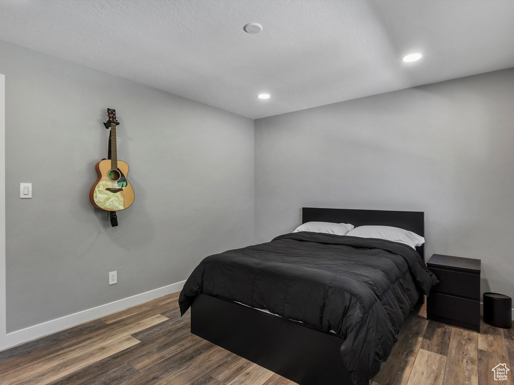 Bedroom featuring wood finished floors and recessed lighting