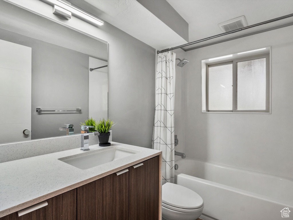Full bath with vanity and shower / bathtub combination with curtain