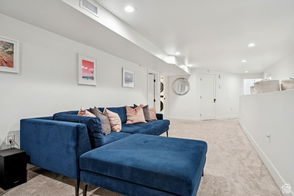 Living room featuring light colored carpet and recessed lighting