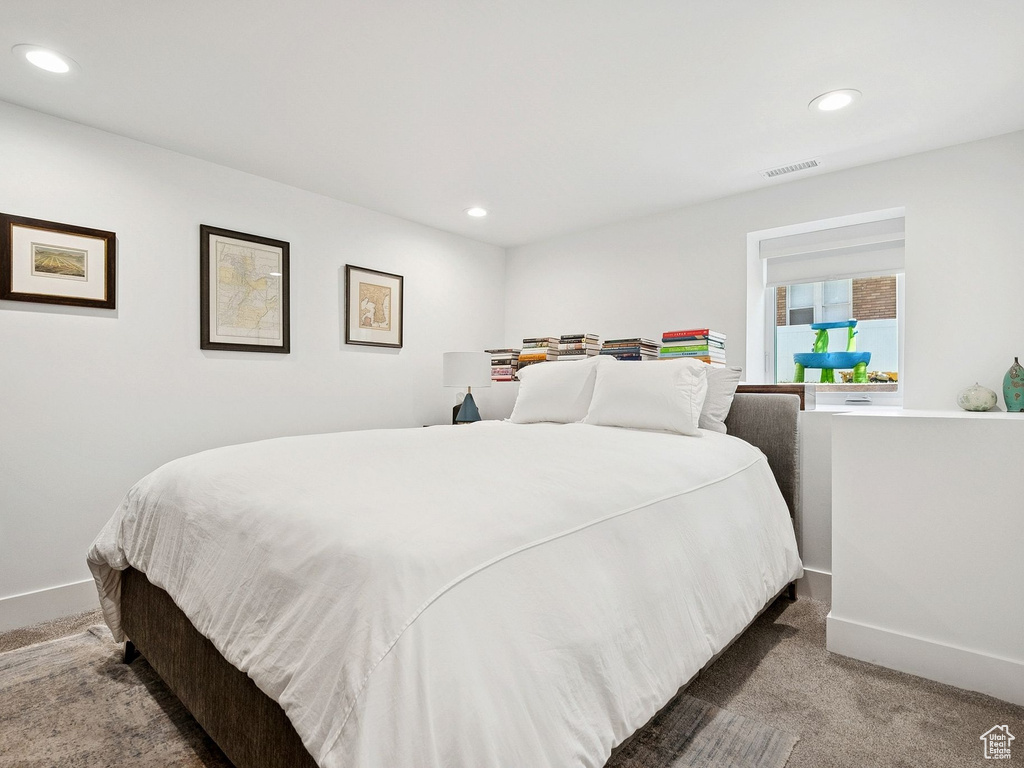 Carpeted bedroom featuring recessed lighting