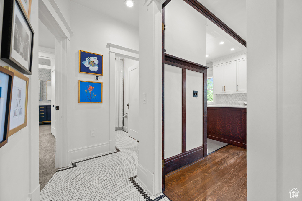 Corridor with recessed lighting and baseboards