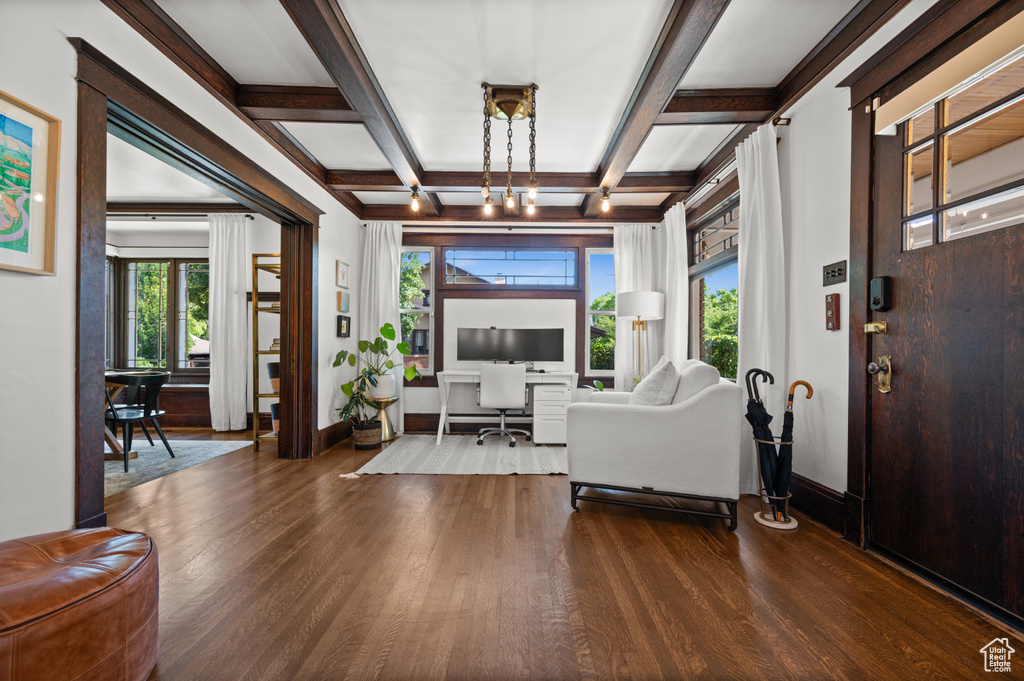 Entrance foyer featuring dark wood-style flooring, coffered ceiling, and beamed ceiling