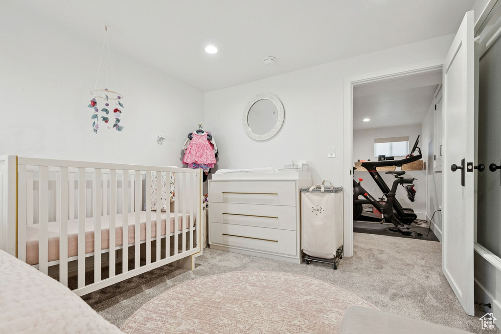 Carpeted bedroom with recessed lighting