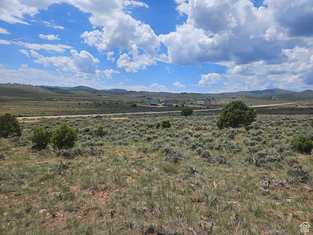 View of mountain background featuring rural landscape