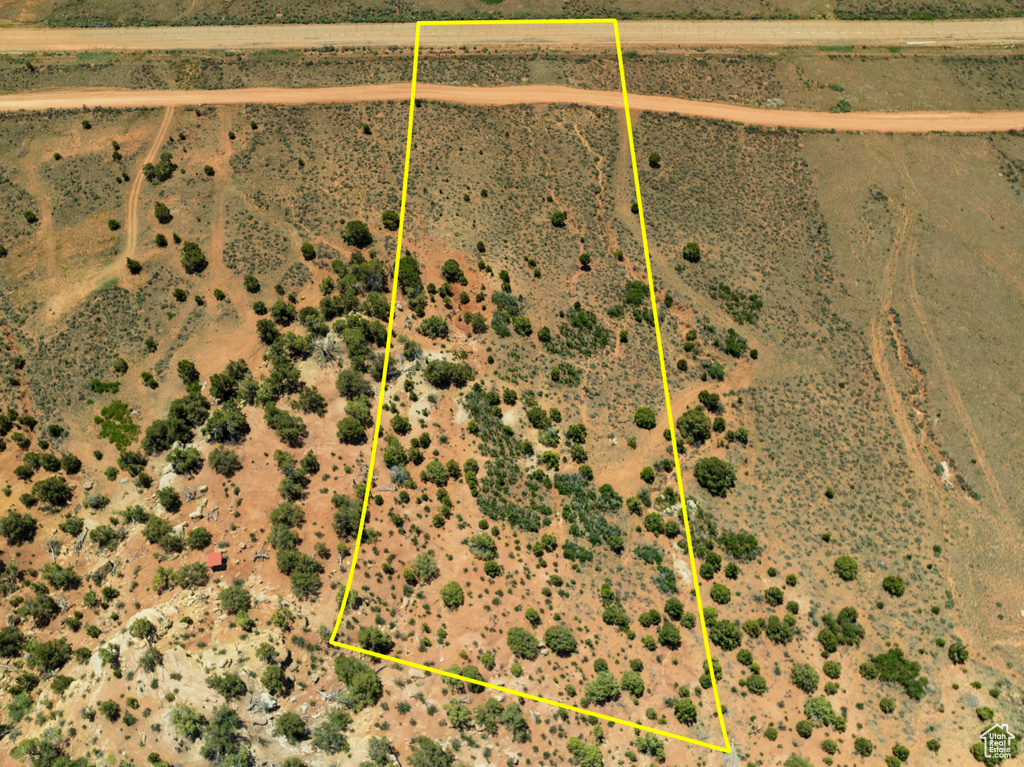 Aerial view of sparsely populated area featuring property boundaries highlighted