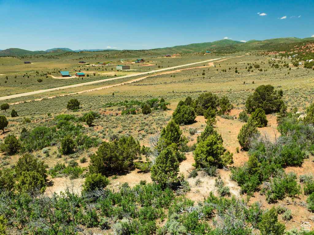 View of mountain background featuring rural landscape