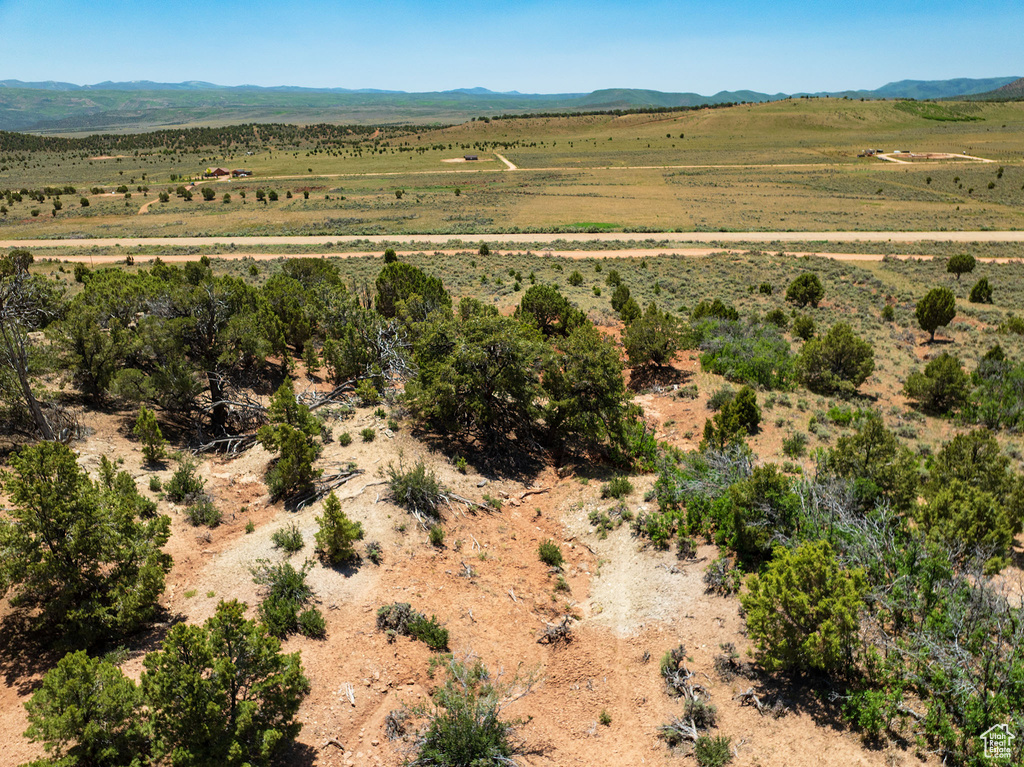 View of mountain backdrop featuring rural landscape