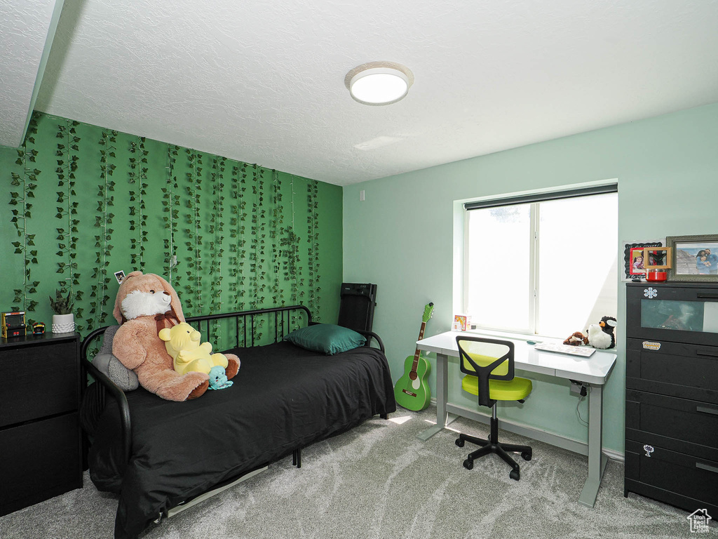 Bedroom with carpet flooring and baseboards