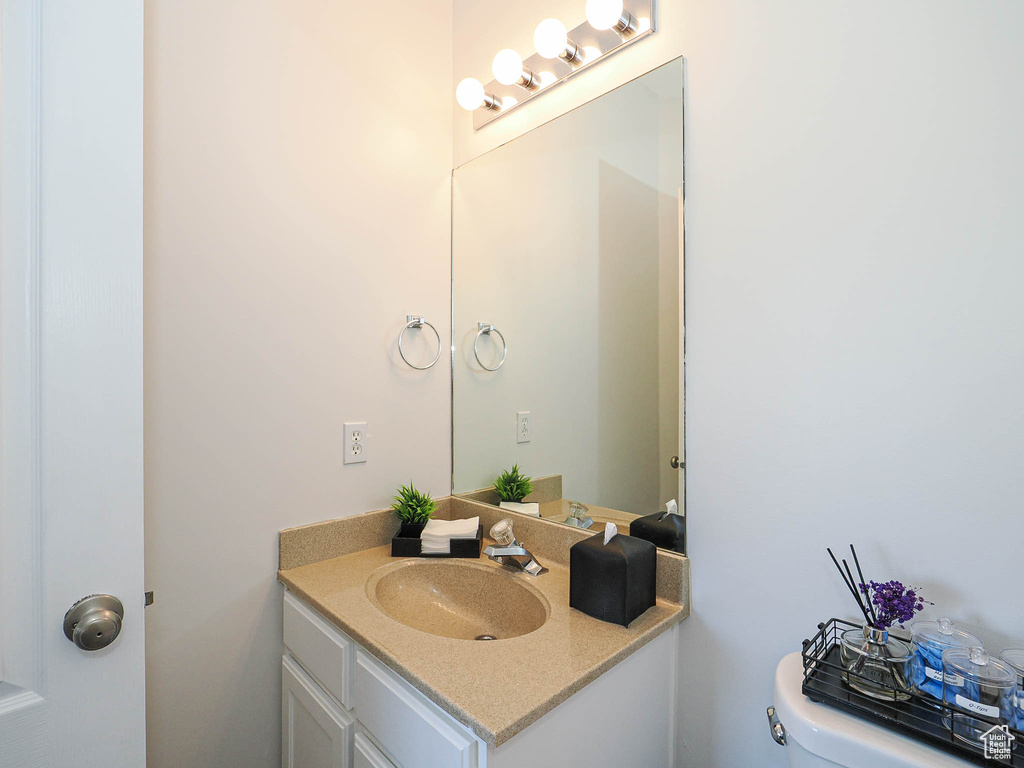 Half bath with vanity and toilet
