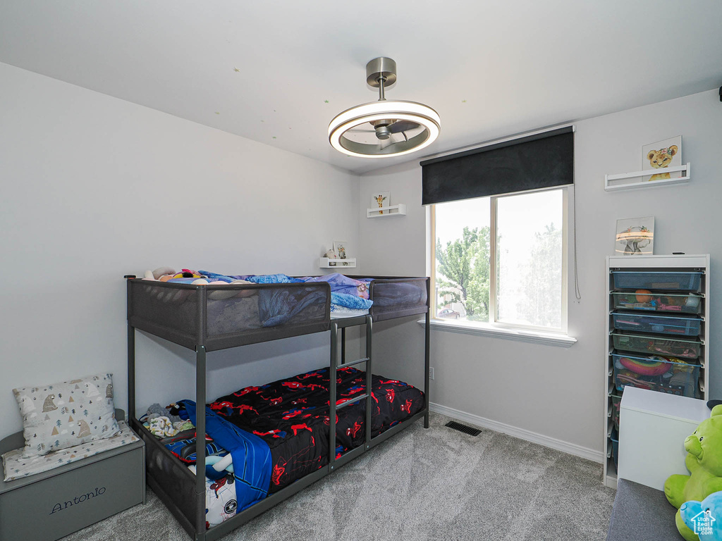 Carpeted bedroom with baseboards