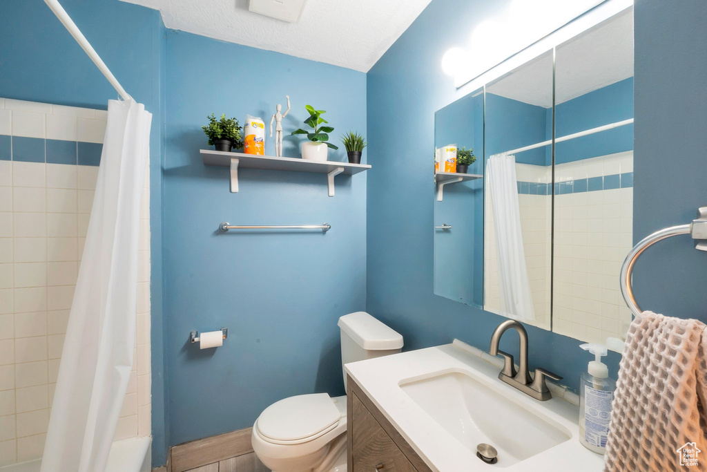 Bathroom featuring toilet and vanity