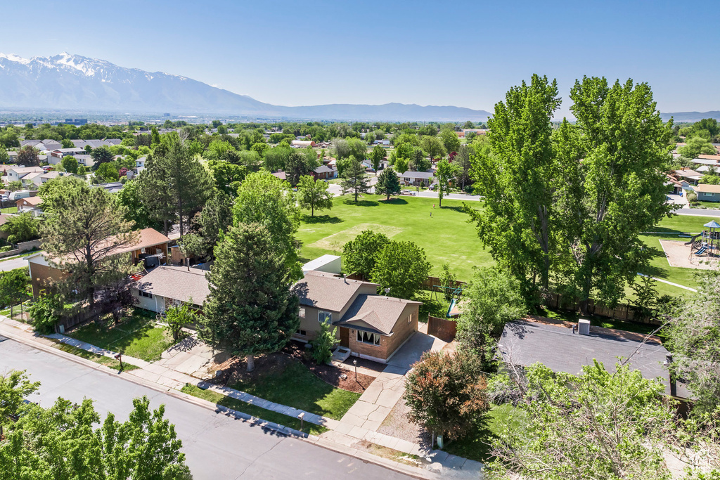 Aerial perspective of suburban area with a mountain backdrop