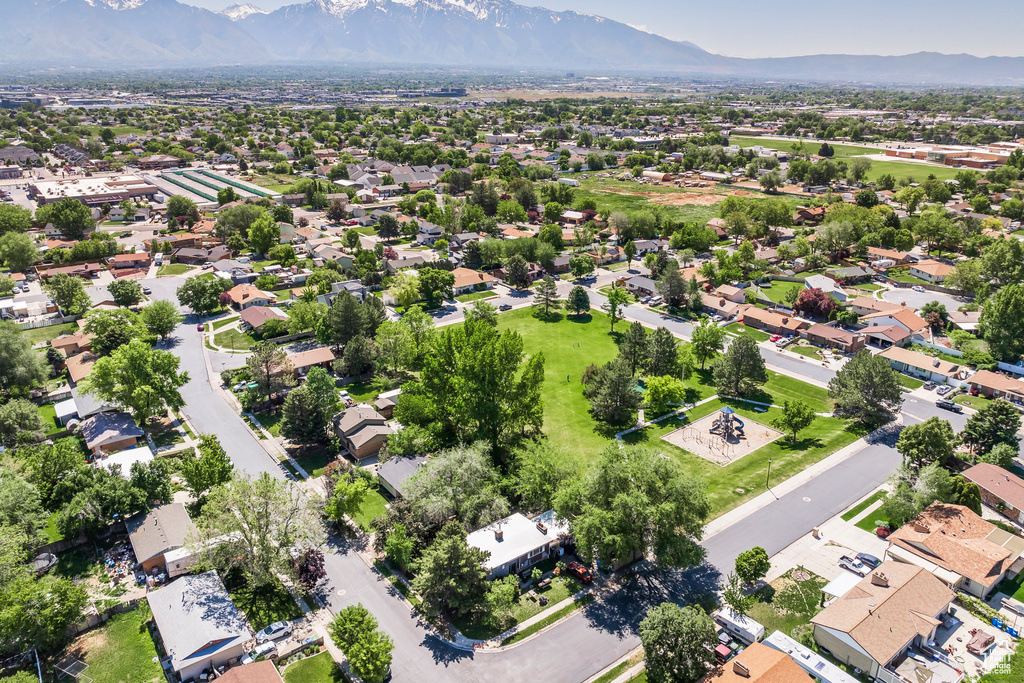 Aerial perspective of suburban area with a mountain backdrop