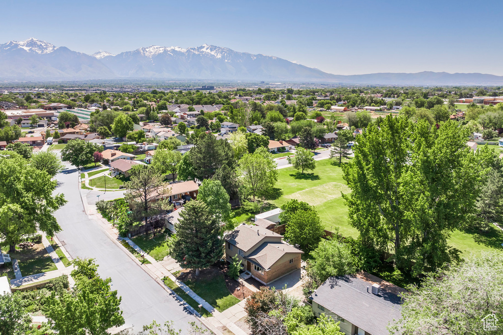 Aerial perspective of suburban area with a mountain backdrop