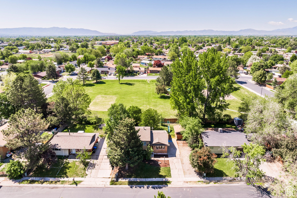 Aerial perspective of suburban area with a mountainous background