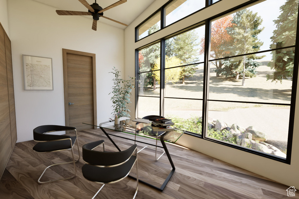 Sunroom / solarium featuring lofted ceiling