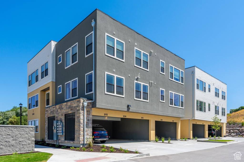 View of building exterior featuring an attached garage