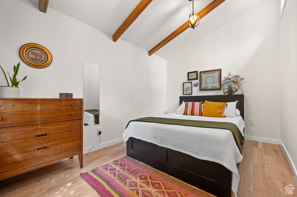 Bedroom featuring light wood finished floors and baseboards
