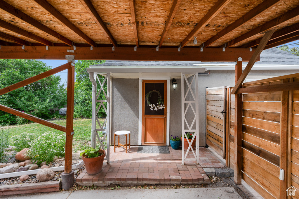 Entrance to property with stucco siding