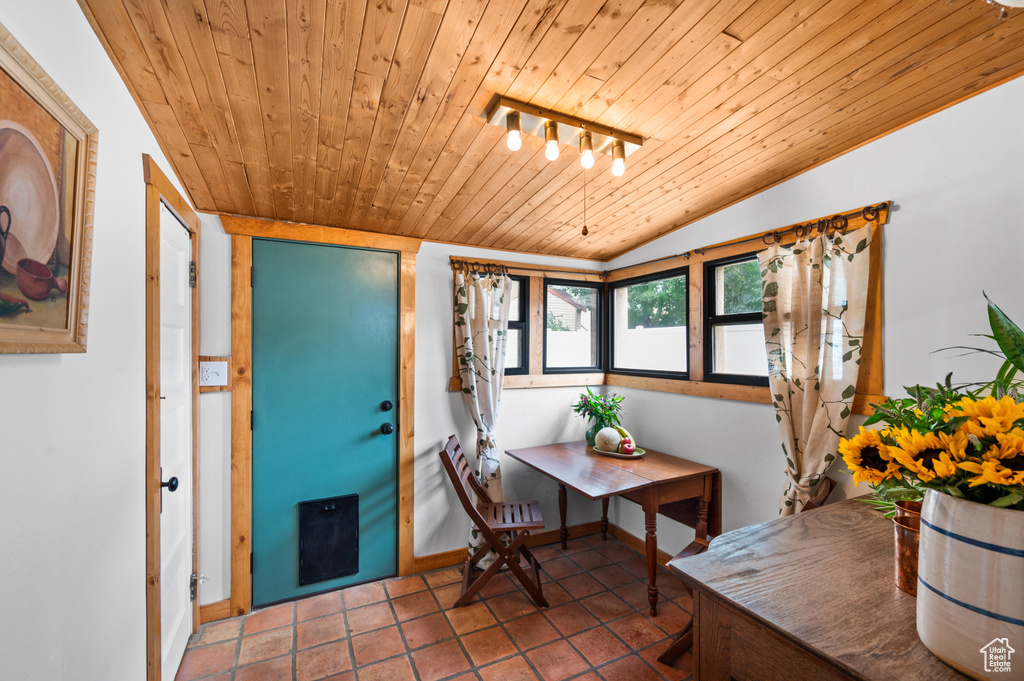 Foyer with wooden ceiling, lofted ceiling, and tile patterned flooring
