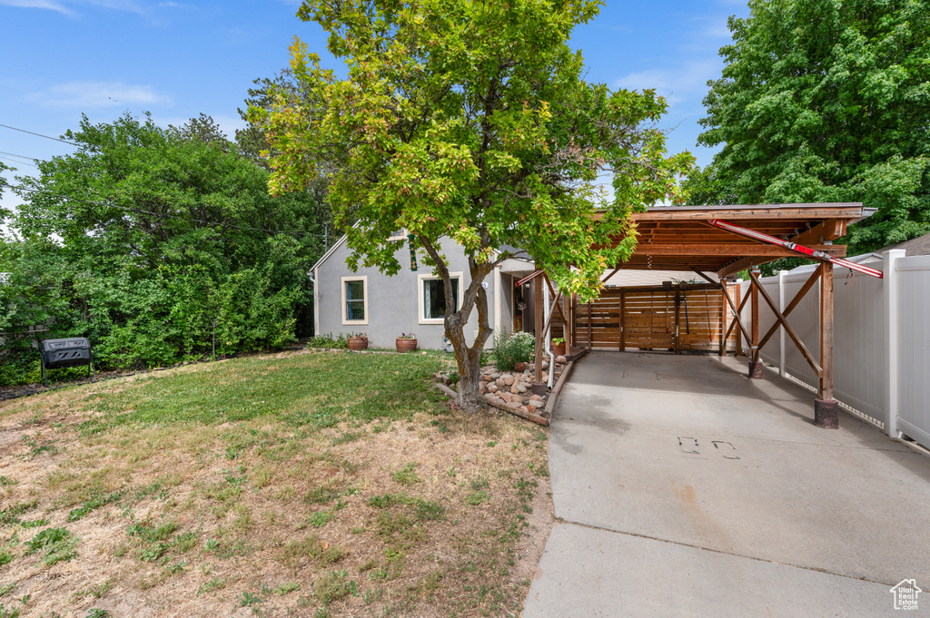 View of yard with a carport