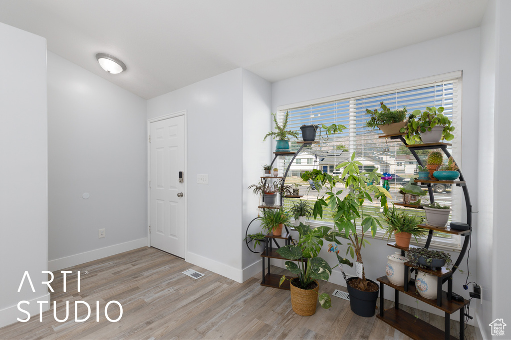 Entrance foyer featuring light wood finished floors and baseboards