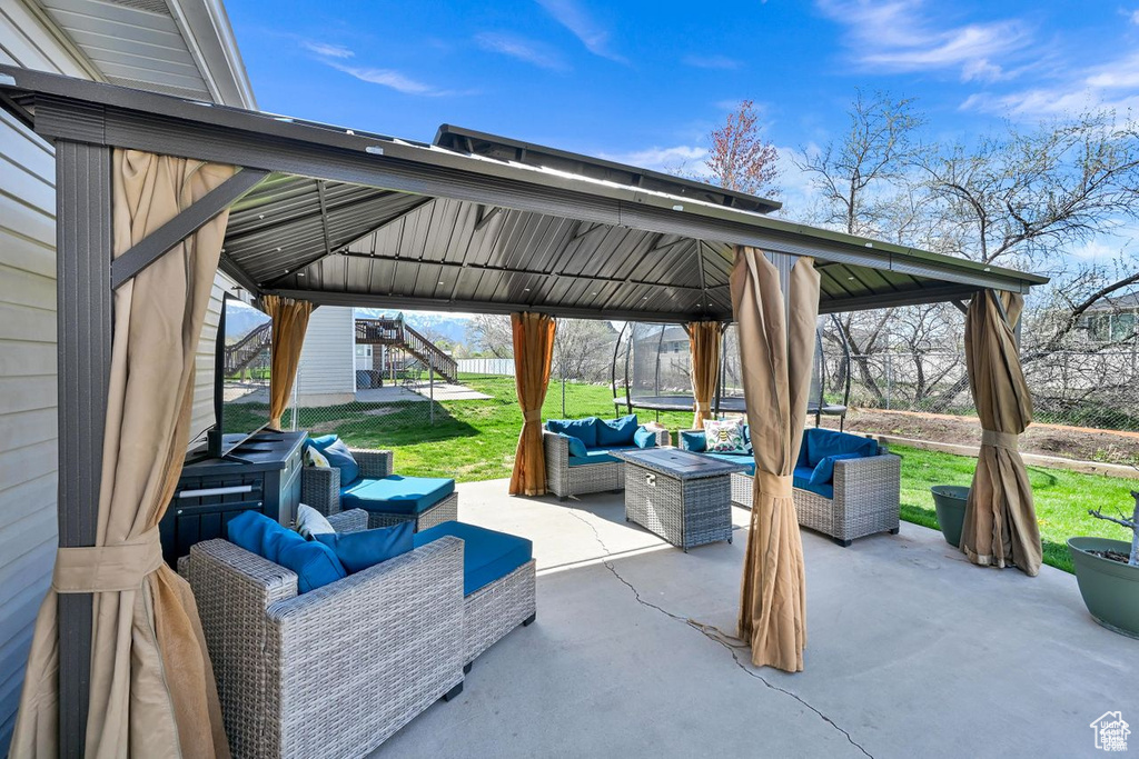 View of patio / terrace featuring a gazebo and an outdoor living space
