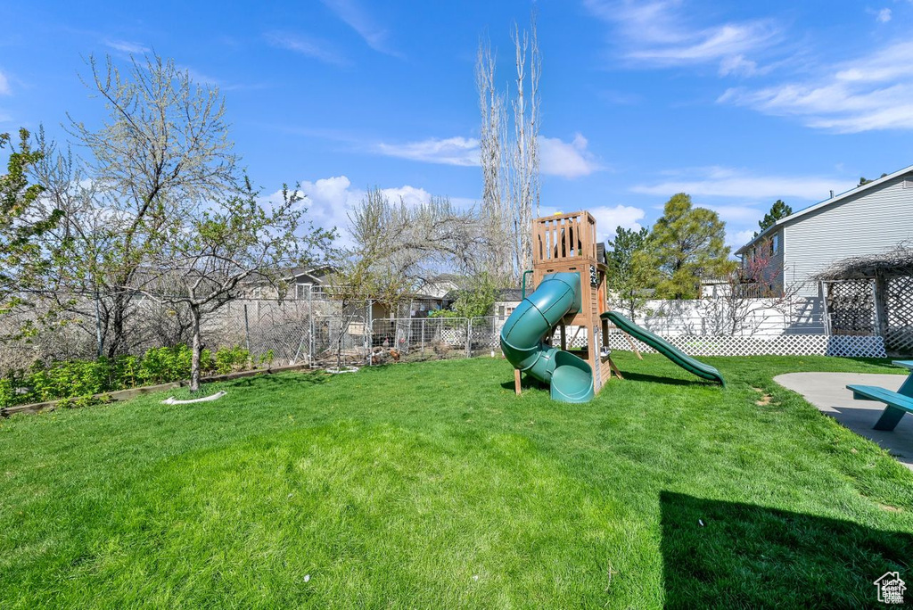 View of yard featuring a playground