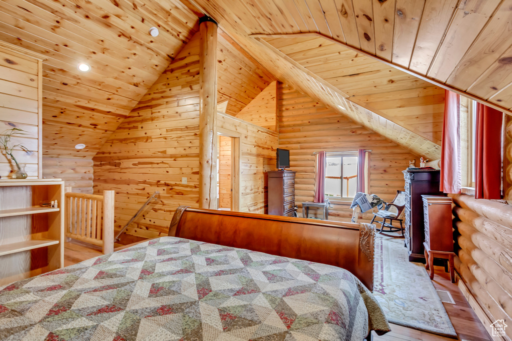 Bedroom featuring wooden ceiling, rustic walls, lofted ceiling, hardwood / wood-style floors, and recessed lighting