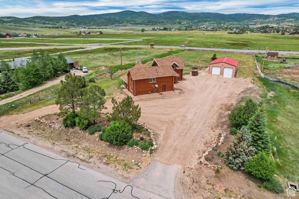 Aerial view of sparsely populated area with a mountain backdrop