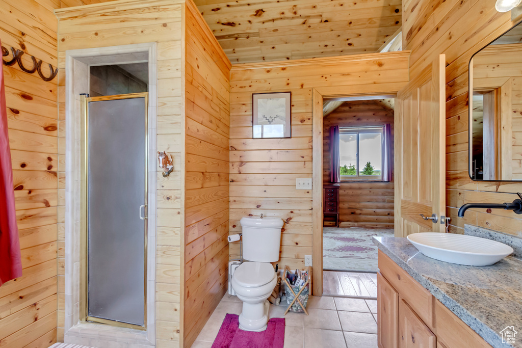 Bathroom with vanity, wood ceiling, a stall shower, wood walls, and tile patterned floors