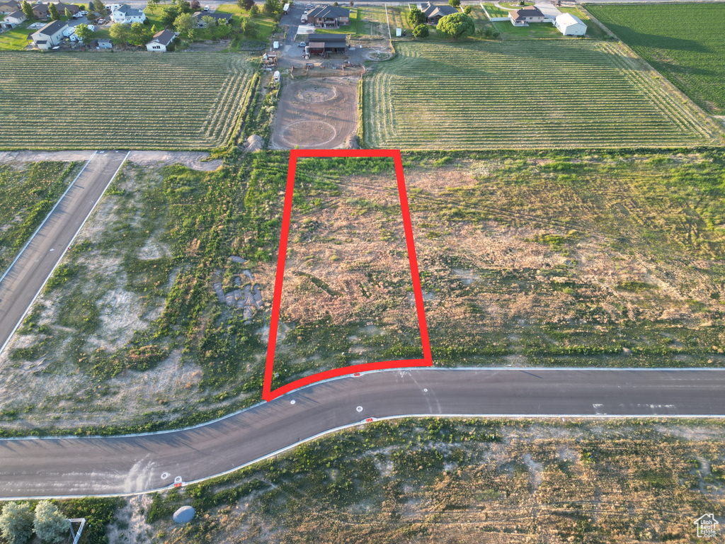 Aerial view of property and surrounding area featuring property boundaries highlighted and rural landscape