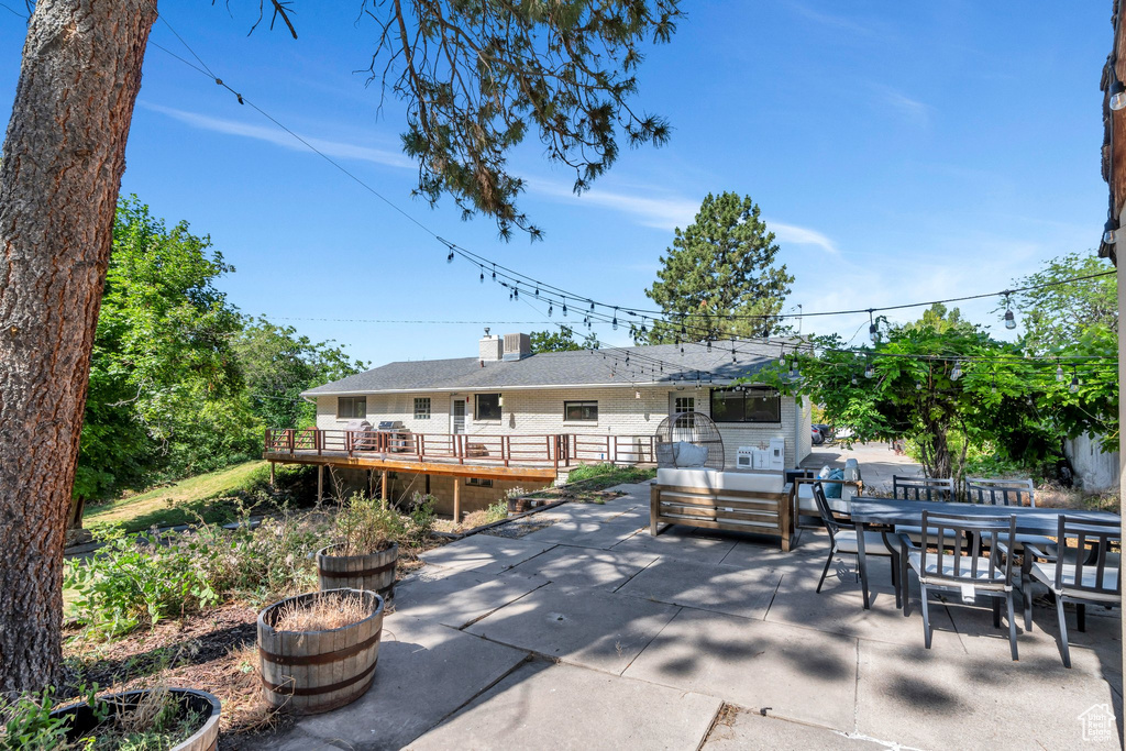 View of patio / terrace featuring outdoor dining space and a deck