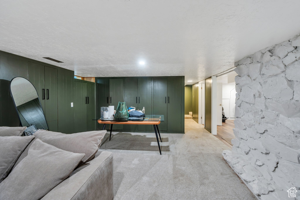 Living area featuring light colored carpet