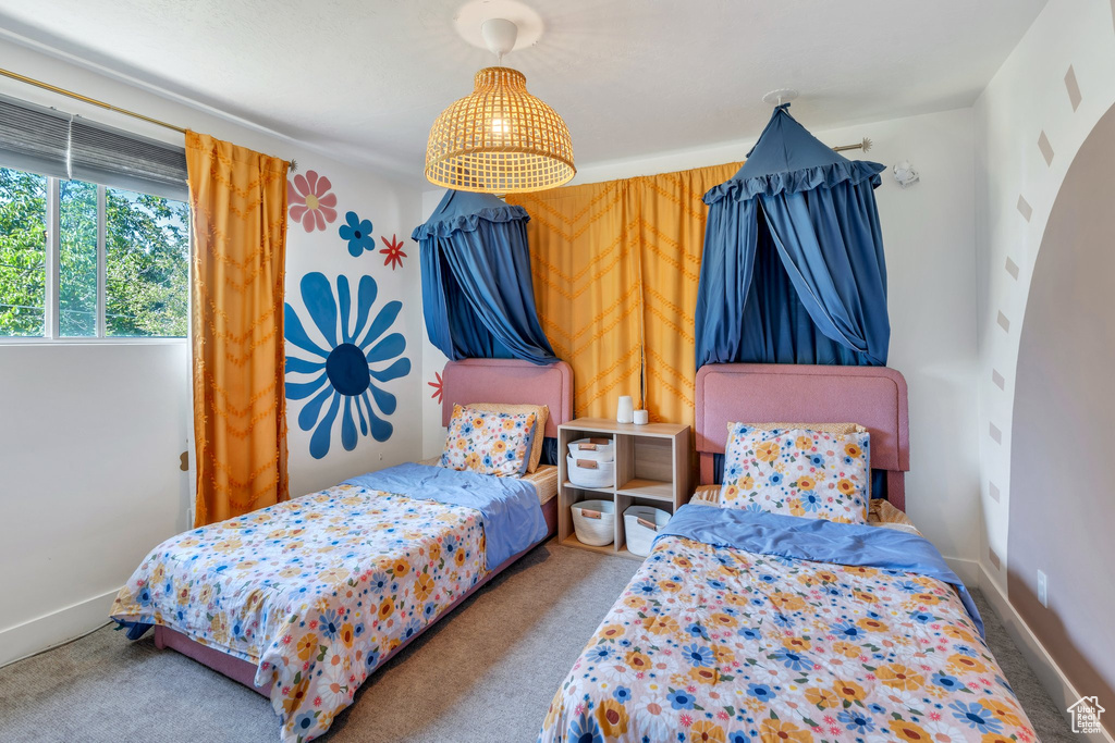Bedroom with carpet flooring and baseboards
