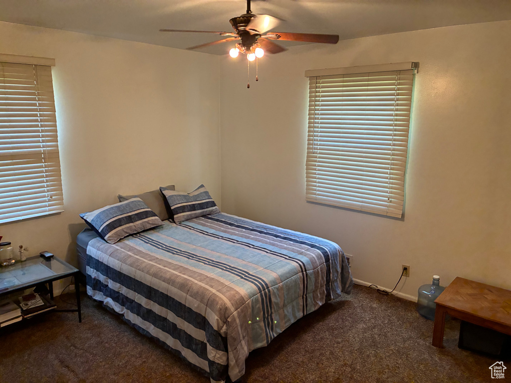 Bedroom with carpet flooring and a ceiling fan