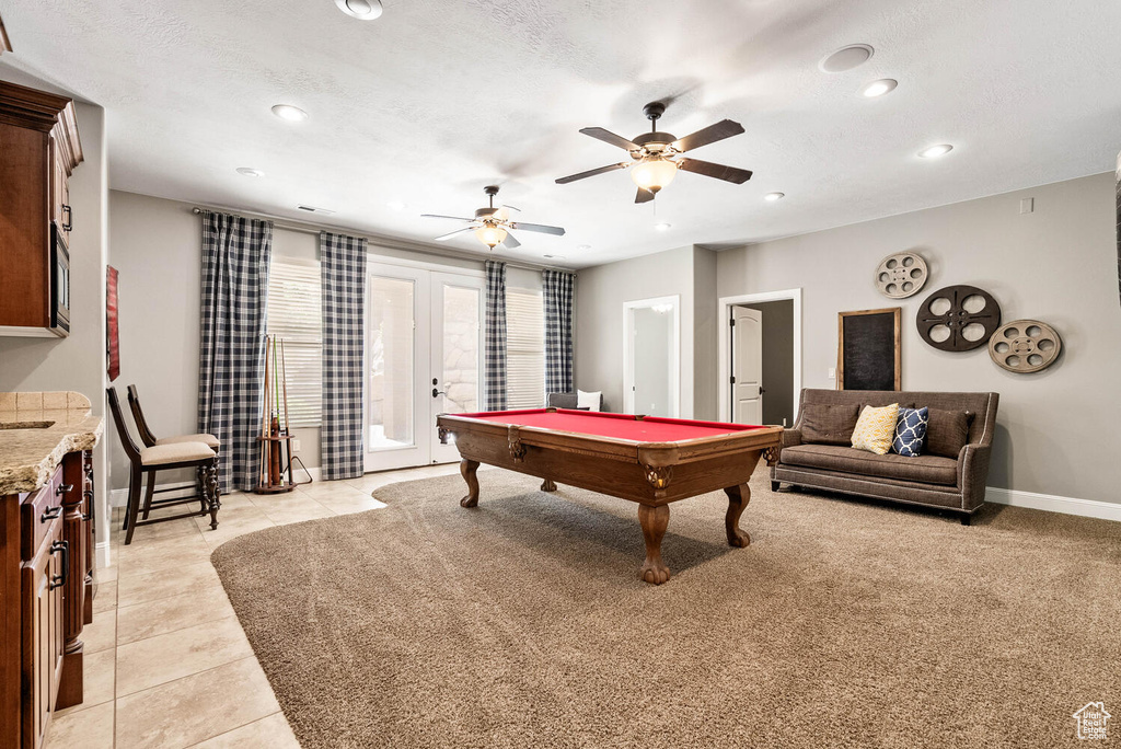 Playroom with billiards table, french doors, recessed lighting, light tile patterned flooring, and ceiling fan
