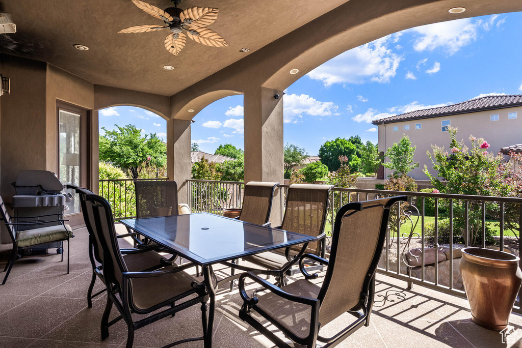 View of patio featuring ceiling fan and outdoor dining space