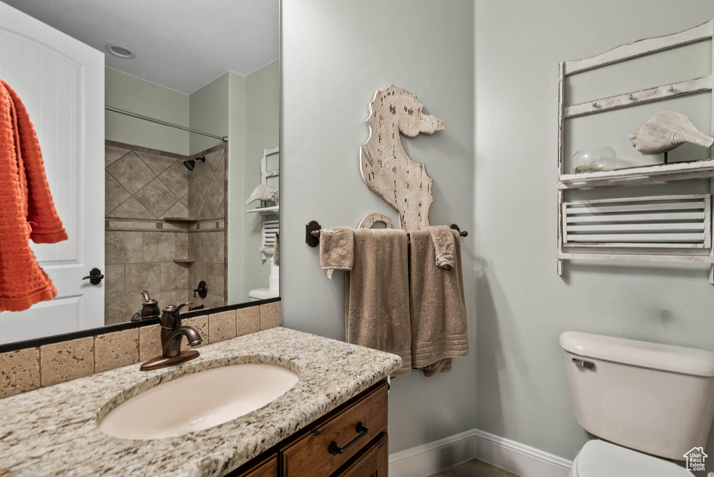 Full bath with vanity and a shower