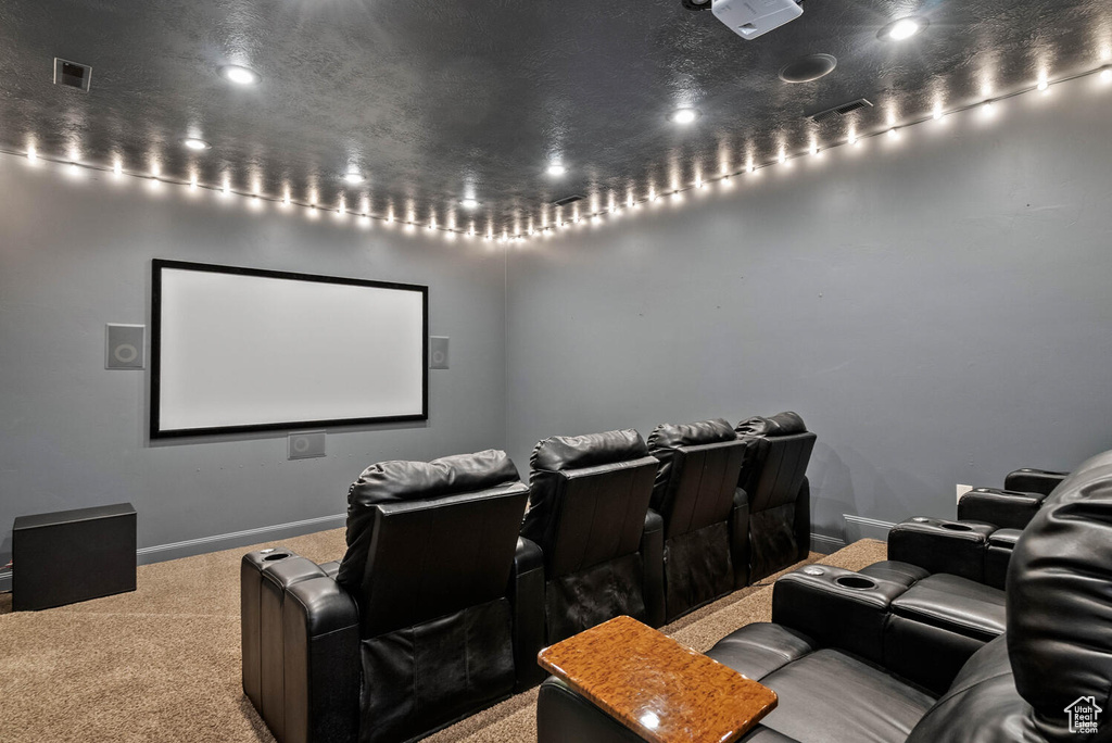 Cinema room featuring carpet floors and recessed lighting