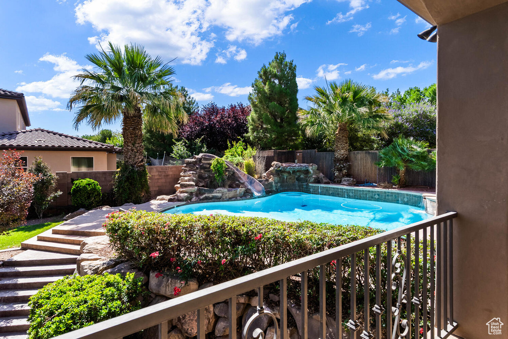 View of pool with a fenced backyard