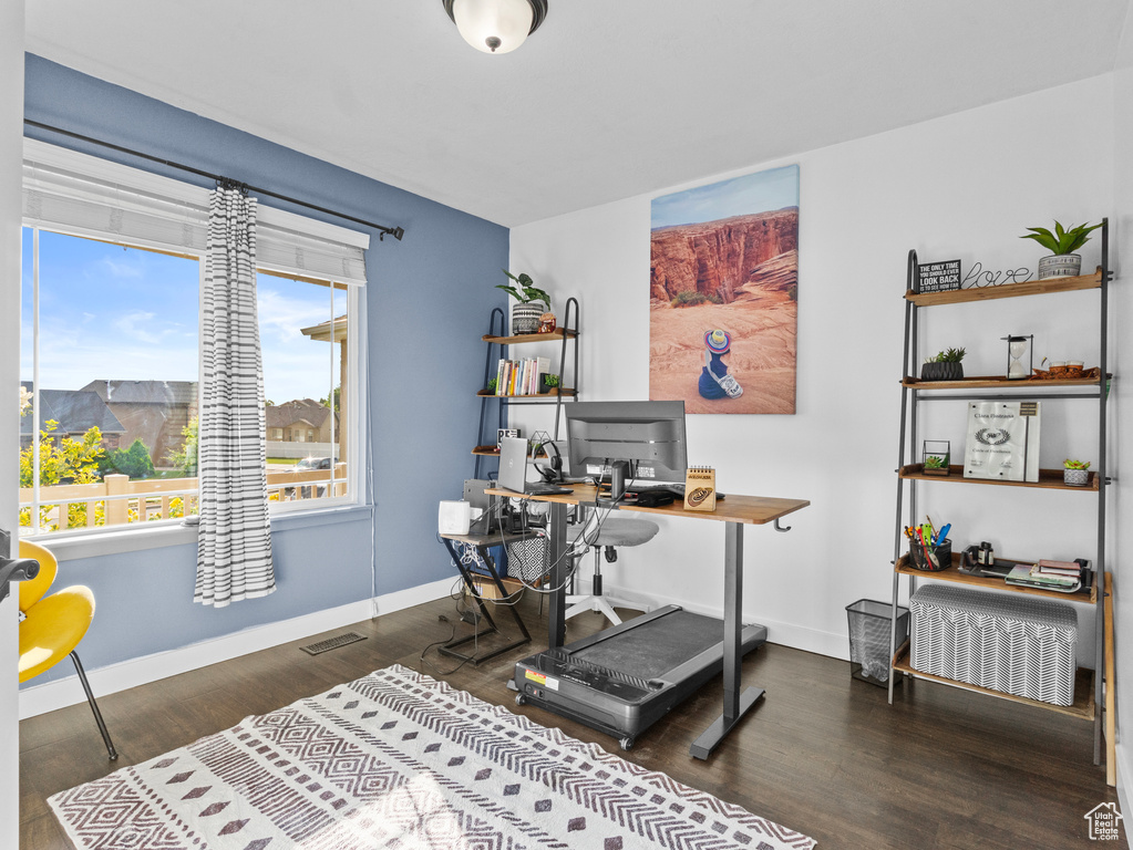 Office featuring baseboards and wood finished floors