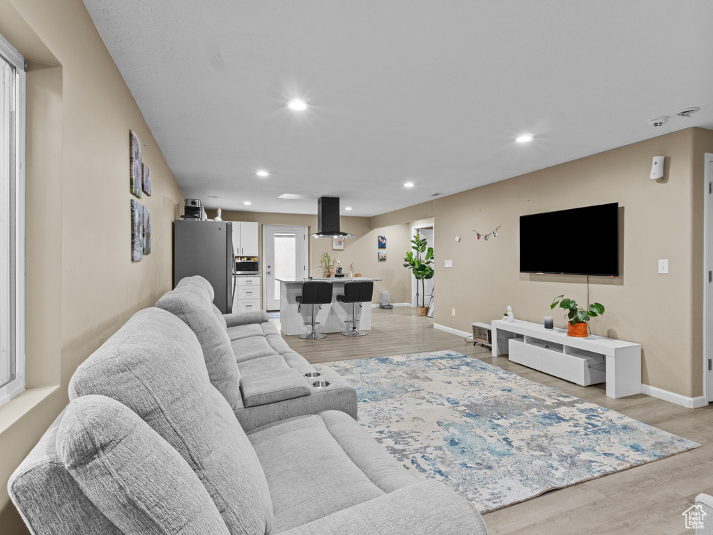Living room featuring recessed lighting and light wood-style floors