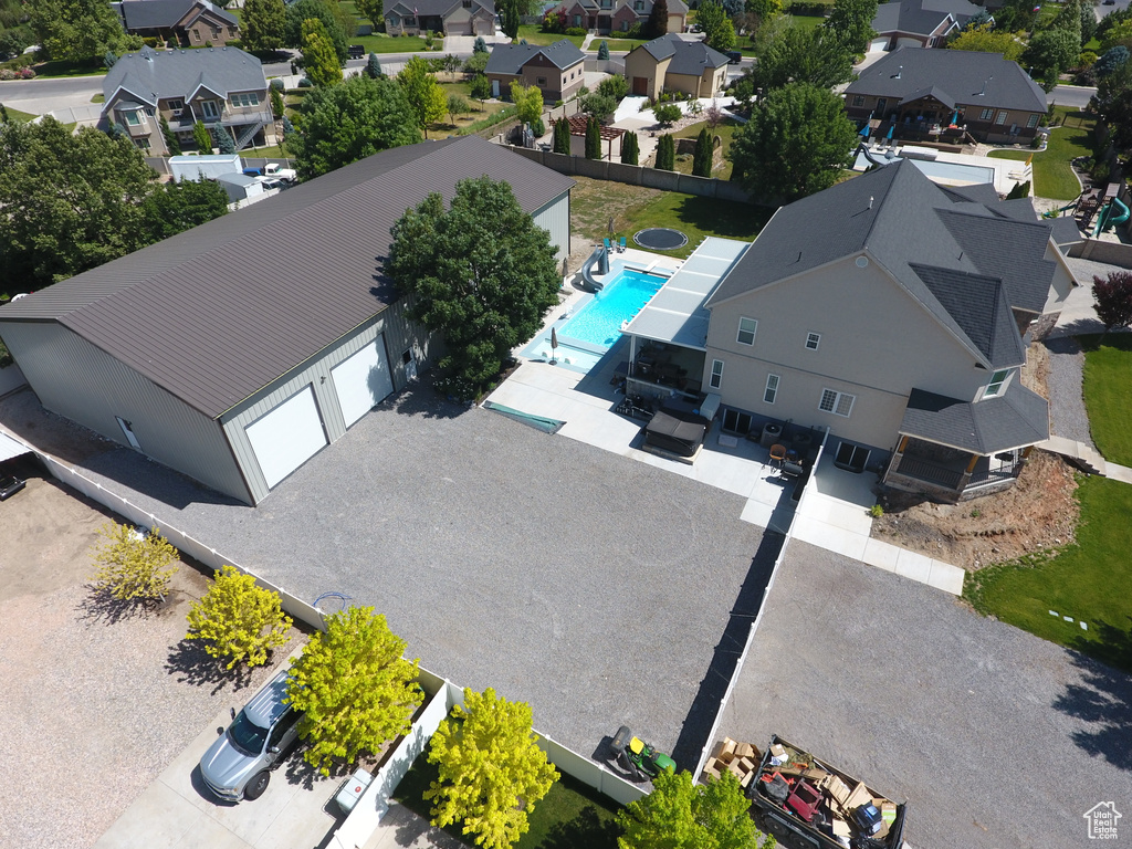 Aerial perspective of suburban area featuring a pool area