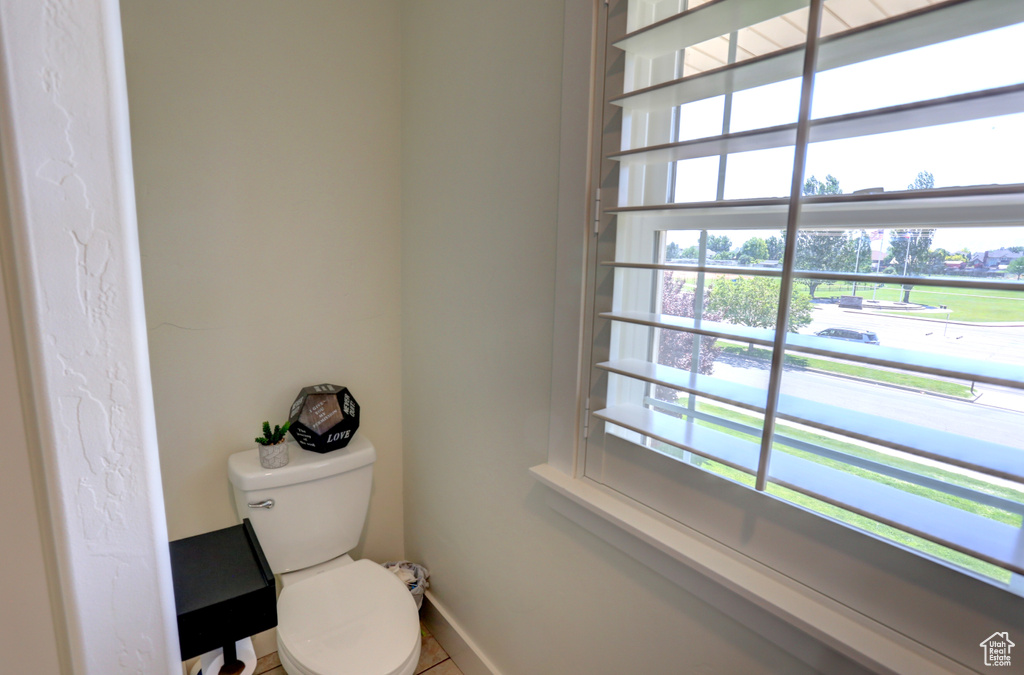 Bathroom with toilet and baseboards