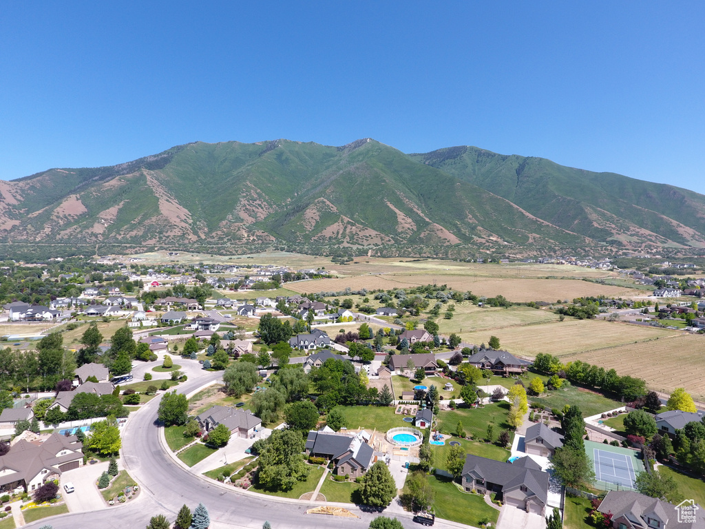 Aerial view of property\'s location with a mountain backdrop