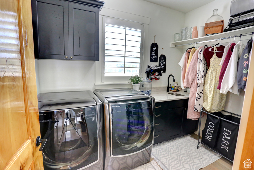 Laundry room with cabinet space and washing machine and dryer