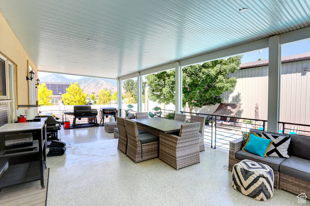 View of patio featuring outdoor dining area and a mountain view