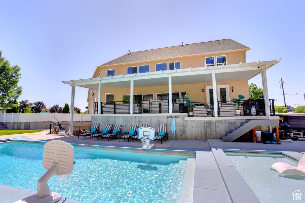 View of pool featuring stairs and a patio
