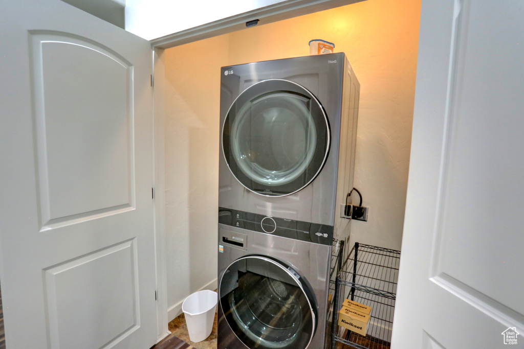 Washroom with stacked washer and clothes dryer